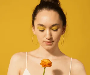 girl holding flower